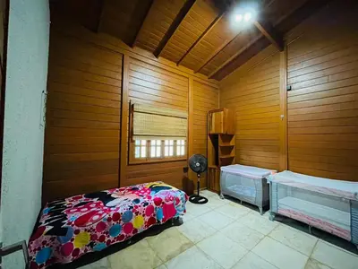 Uma cama ou camas num quarto em Casa de Madeira 700 Serra Meruoca