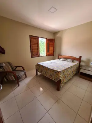 Uma cama ou camas num quarto em Chalé Kalmaria