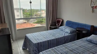 Uma cama ou camas num quarto em Encanto da Praia do Futuro 1