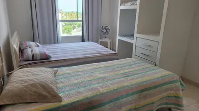 Uma cama ou camas num quarto em Encanto da Praia do Futuro 1