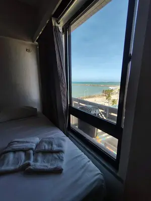 Uma cama ou camas num quarto em Flat na praia de iracema 504