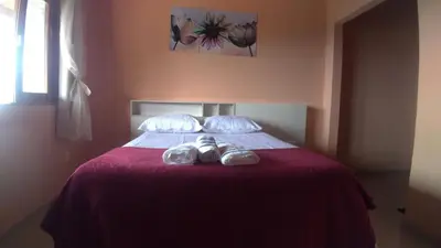 Uma cama ou camas num quarto em Belaninha