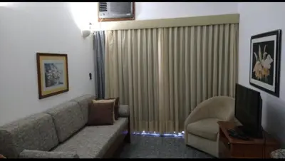 Uma área de estar em Excelente Flat 1506 Meireles Fortaleza