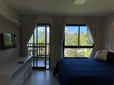 Uma cama ou camas num quarto em Bangalô frente ao mar Vg Sun Cumbuco
