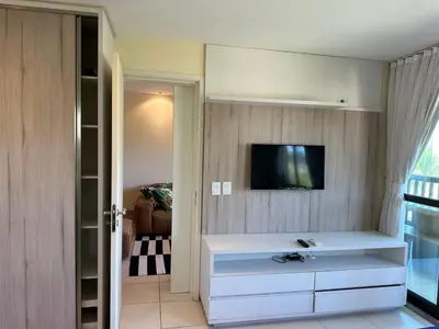 Uma televisão e/ou sistema de entretenimento em Bangalô frente ao mar Vg Sun Cumbuco