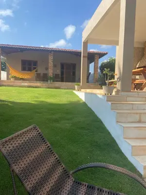 Um jardim no exterior de Casa Paraíso Guajiru