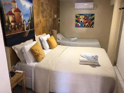 Uma cama ou camas num quarto em Pousada Vila Canoa