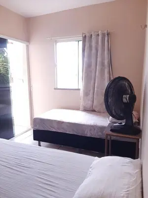 Uma cama ou camas num quarto em Duplex Arretadinho