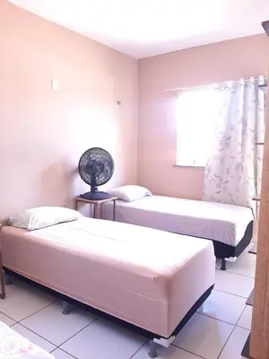Uma cama ou camas num quarto em Duplex Arretadinho