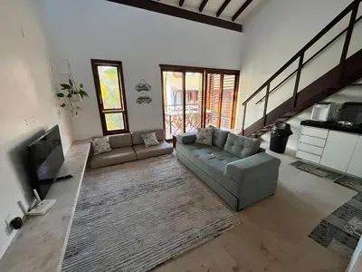 Uma área de estar em Taiba Beach Resort - Apt Duplex Novo