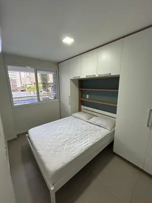 Uma cama ou camas num quarto em Apartamento a 50m da Beira Mar