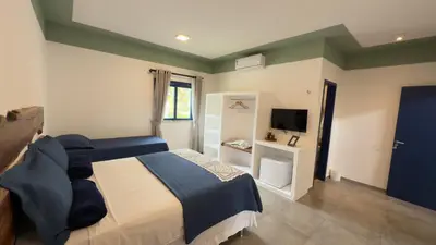 Uma televisão e/ou sistema de entretenimento em Boulevard Pousada Boutique