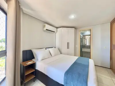 Uma cama ou camas num quarto em Apart-Hotel Iate Plaza, vista completa da Orla de Fortaleza