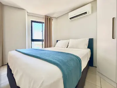 Uma cama ou camas num quarto em Apart-Hotel Iate Plaza, vista completa da Orla de Fortaleza