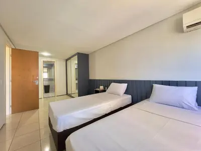 Uma cama ou camas num quarto em Apart-Hotel Iate Plaza, vista completa da Orla de Fortaleza