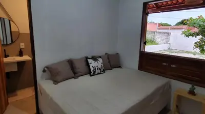 Uma cama ou camas num quarto em Casa Rústica em Condomínio com Piscina