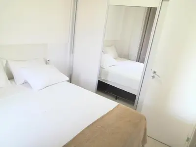 Uma cama ou camas num quarto em VG fun - Mar e Sol