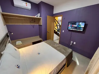 Uma televisão e/ou sistema de entretenimento em Cidade Jardim Apart