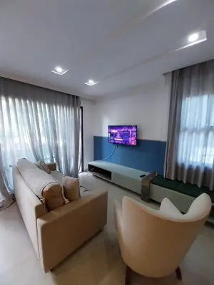 Uma televisão e/ou sistema de entretenimento em Cidade Jardim Apart