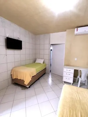 Uma cama ou camas num quarto em Amazônia Praia Hotel
