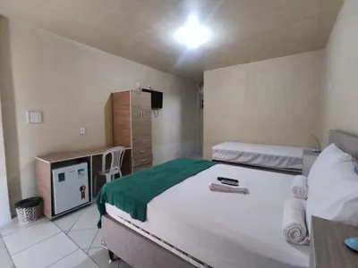 Uma cama ou camas num quarto em Amazônia Praia Hotel