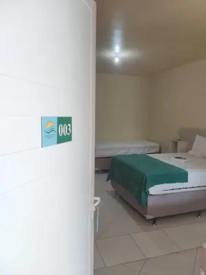 Uma cama ou camas num quarto em Amazônia Praia Hotel