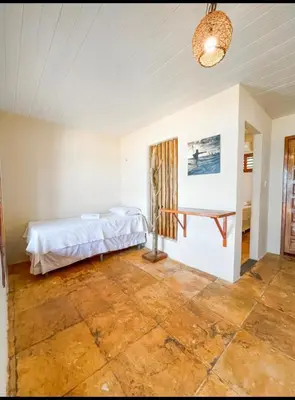 Uma cama ou camas num quarto em Pousada Estrela Peroba