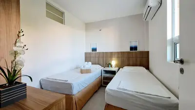 Uma cama ou camas num quarto em Apartamento pé na areia com jacuzzi - 3 quartos - 7 hóspedes - Beach Park