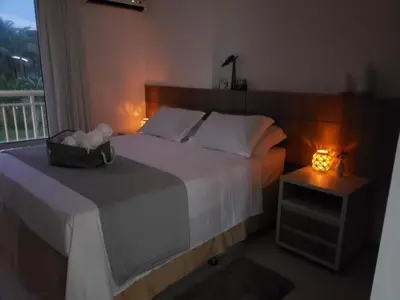 Uma cama ou camas num quarto em Apartamento pé na areia com jacuzzi - 3 quartos - 7 hóspedes - Beach Park